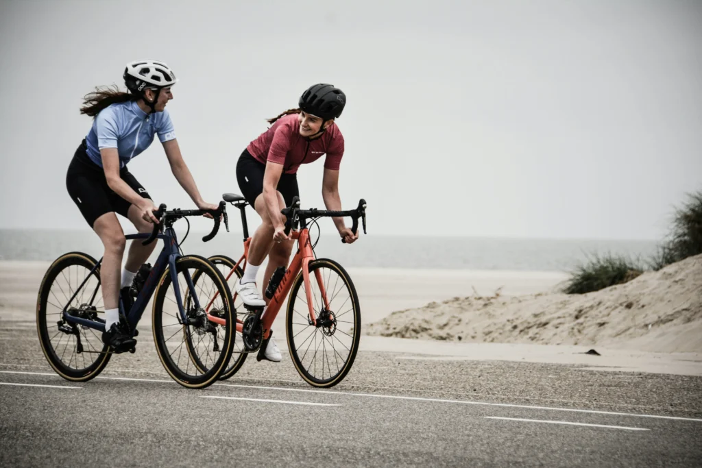 Two Person cycling outdoors as part of a healthy active lifestyle