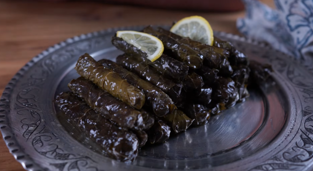 Turkish stuffed vine leaves Yaprak Sarma filled with rice herbs pine nuts and currants