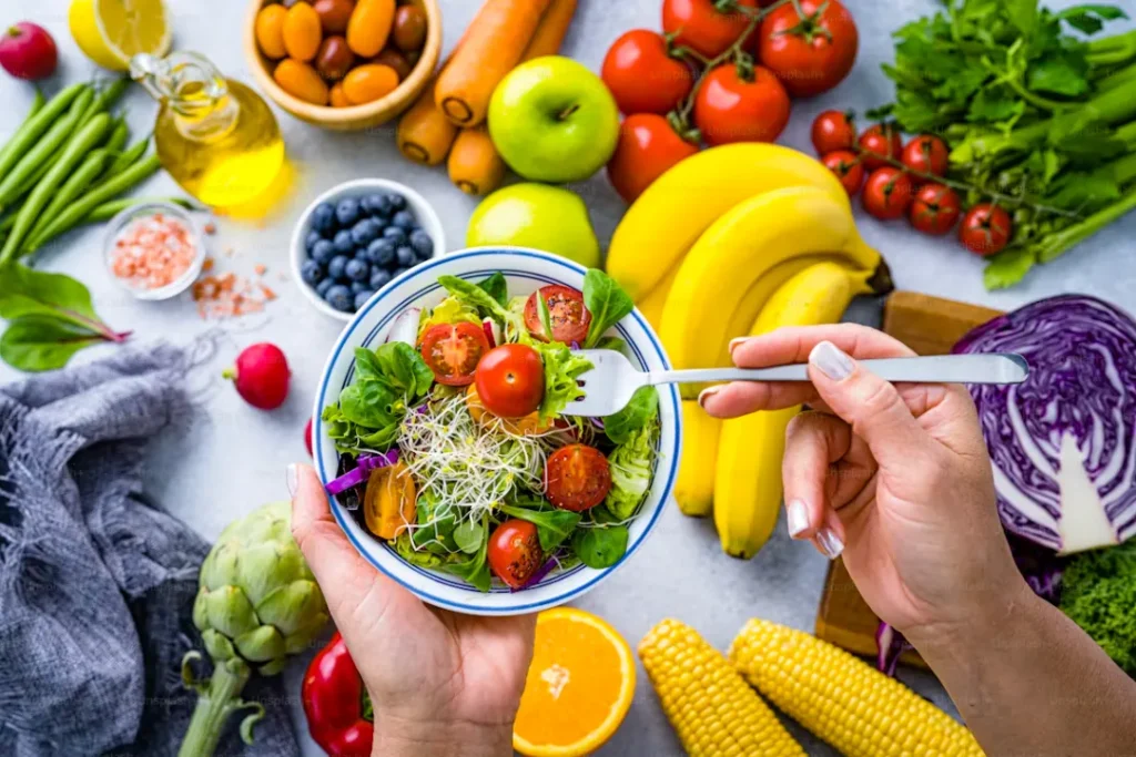 Heart healthy foods including salmon berries dark chocolate eggs nuts and olive oil