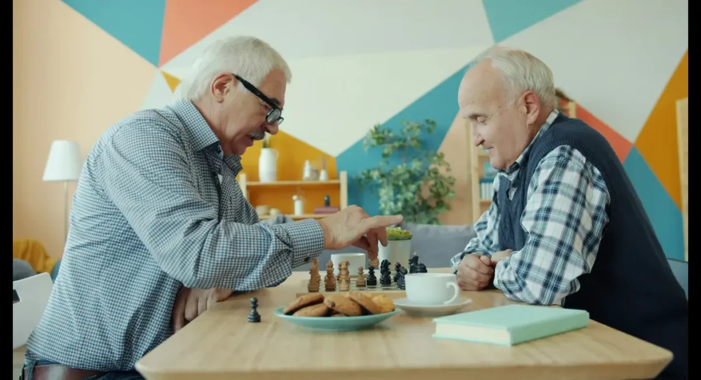 Older men playing chess together to keep their minds active.