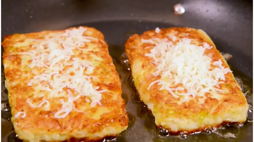 Golden-brown cabbage and chicken fritters served with creamy cucumber, dill, and garlic sauce.