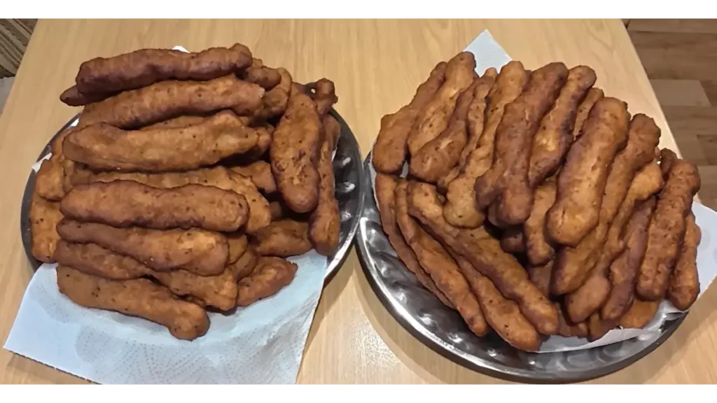 Traditional Zalabia shaped into elongated pieces and fried until golden brown